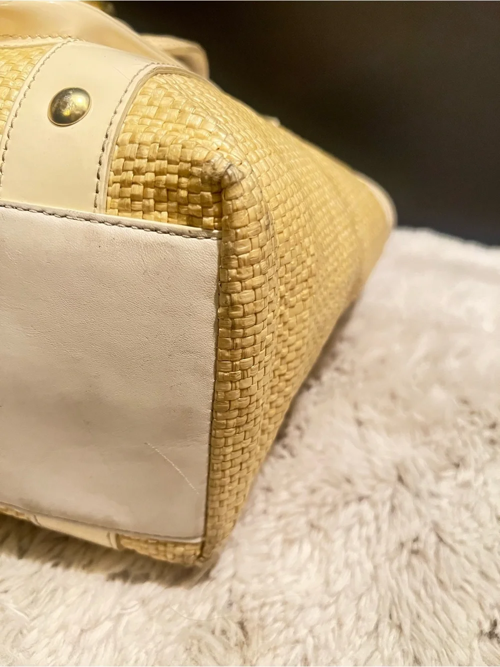 Coach white leather and straw tote.
